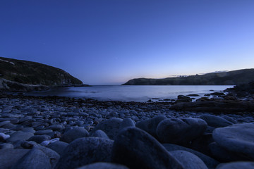 sunset on coast of sea