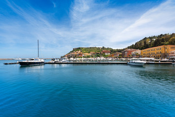 Fototapeta na wymiar Porto Ercole village and boats in the harbour. Monte Argentario, Maremma Grosseto Tuscany, Italy