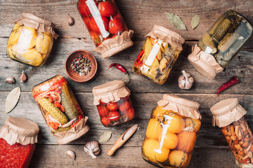 Сucumber, squash and tomatoes pickling and canning into glass jars. Ingredients for vegetables...