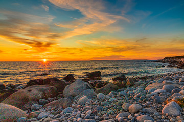 Beautiful coastal sunset scene along the Atlantic Ocean at dusk.