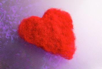 fabric heart on a blue background
