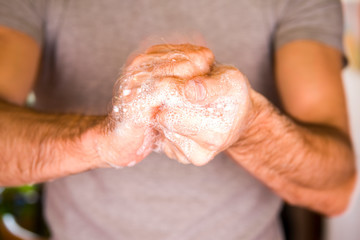 Washing hands rubbing with soap man for corona virus prevention, hygiene to stop spreading coronavirus