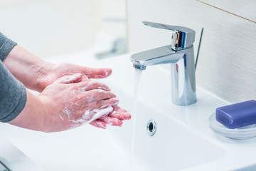 Hand washing with soap.