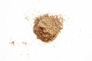 Food and spices. A scattering of ground cardamom spices on a white background