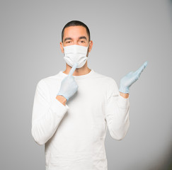 Coronavirus.Young man doing concepts and wearing mask and protective gloves