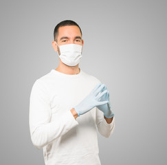 Coronavirus.Young man doing concepts and wearing mask and protective gloves