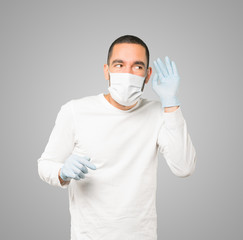 Coronavirus.Young man doing concepts and wearing mask and protective gloves