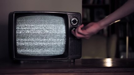 Male Hand hitting an Old Broken TV with Green Screen. You can replace green screen with the footage or picture you want. You can do it with “Keying” effect in After Effects. - Powered by Adobe