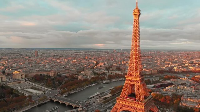 Aerial close up view of Paris Eiffel Tower Tour de Eiffel and panoramic view over Seine River and Paris city attractions at sunset 