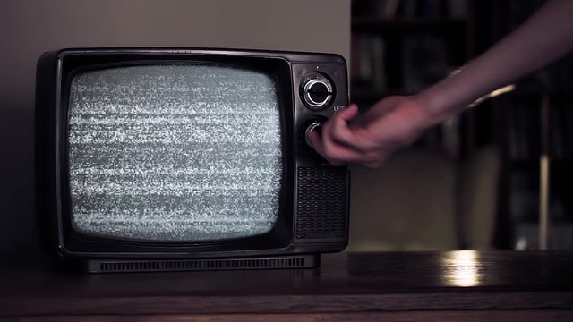Male Hand hitting an Old Broken TV with Green Screen. You can replace green screen with the footage or picture you want. You can do it with “Keying” effect in After Effects.
