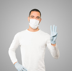 Coronavirus.Young man doing concepts and wearing mask and protective gloves