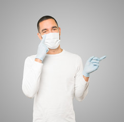 Coronavirus.Young man doing concepts and wearing mask and protective gloves