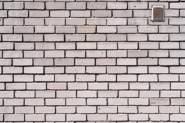 Old realistic brick wall made of white brick. White uneven brickwork.