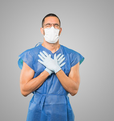 Coronavirus.Young man doing concepts and wearing mask and protective gloves