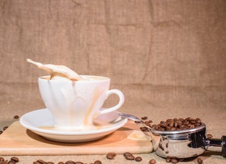 Splash from a cup with a coffee drink. Beautiful background.