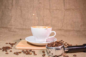 Splash from a cup with a coffee drink. Beautiful background.