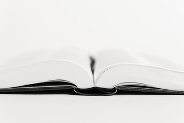 An open book on a table.
