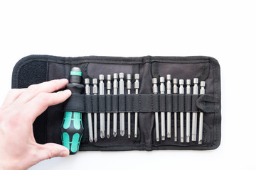 A set of screwdrivers with nozzles in a black case, on a white background.