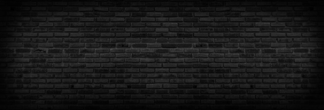 Panorama Black brick walls that are not plastered background and texture. The texture of the brick is black. Background of empty brick basement wall.