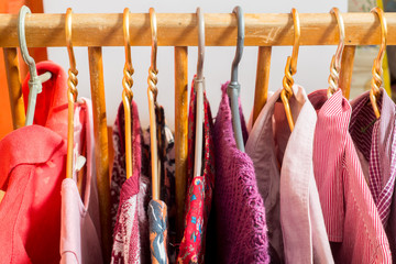 Lot of different clothes on hangers. Copy space