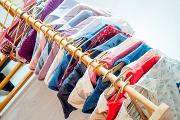 Lot of different clothes on hangers. Copy space