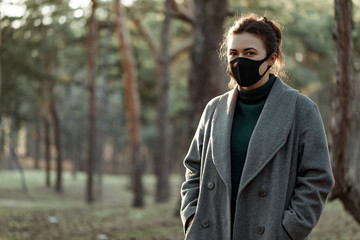 asian woman in medical mask. a girl in a protective mask that protects against viruses