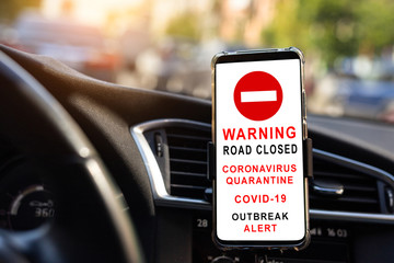 Modern smartphone device gadget mounted phone holder at car dashboard. showing traffic information...