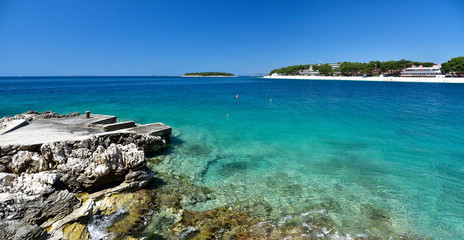 Fototapeta premium Landscape of blue Adriatic lagoon - view from the boardwalk in Promestein, Dalmatia, Croatia