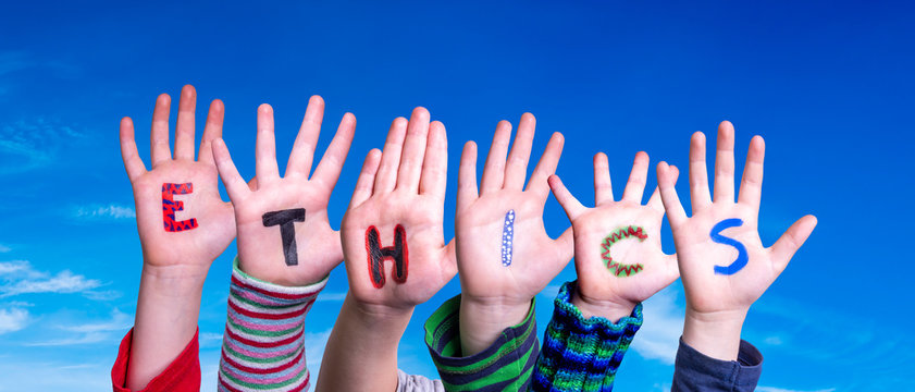 Children Hands Building Colorful Word Ethics. Blue Sky As Background