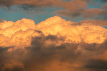 Orange clouds and sky background at golden hour time. Sunset