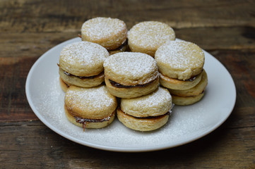 Traditional serbian vanilla cookies, vanilice on the white plate, close up