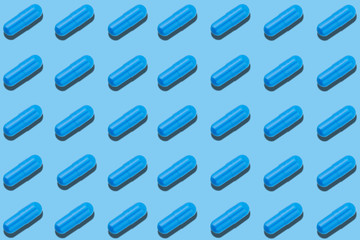 Seamless pattern with blue pills on blue background.