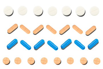 Lots of different multicolored medicinal medicine drugs, pills isolated on white background