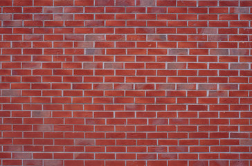 Red burned brick wall background