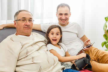 Obraz premium father, son and granddaughter at home