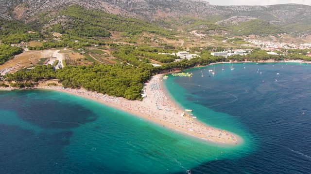 Aerial, drone footage of beach Zlatni Rat, Bol on island of Brac in Croatia and the crystal waters of Adriatic Sea