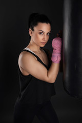 Naklejka premium sexy girl training in the gym engaged in boxing
