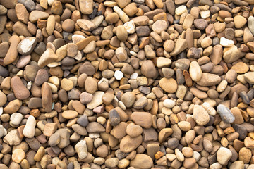 Smooth stones, sea pebbles. Stone sea background.
