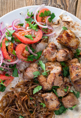 grilled marinated pork with onion and fresh salad 