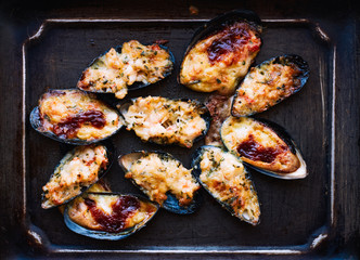 Baked mussels with cheese and teriyaki sauce seafood 