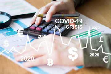 Сovid-19 crisis of the economic system due to the coronavirus epidemic. A businessman looks at a...