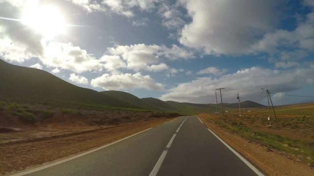 POV Camera car driving on coastline road along Atlantic Ocean. Road from Lgzira beach to Sidi Ifni city in Morocco