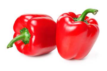 two red sweet bell peppers isolated on white background