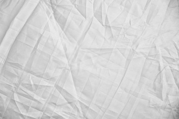 light background: Crumpled fabric, black and white, enhanced contrast