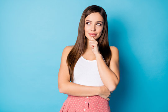 Portrait of minded girl touching her chin hand think thoughts try find solution wear summer season clothes isolated over blue color background