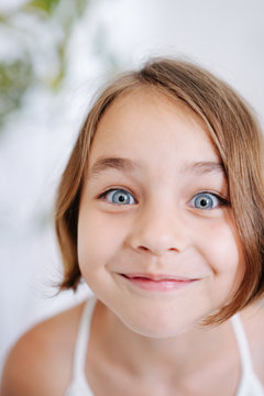 Close up photo of a little girl making funny face