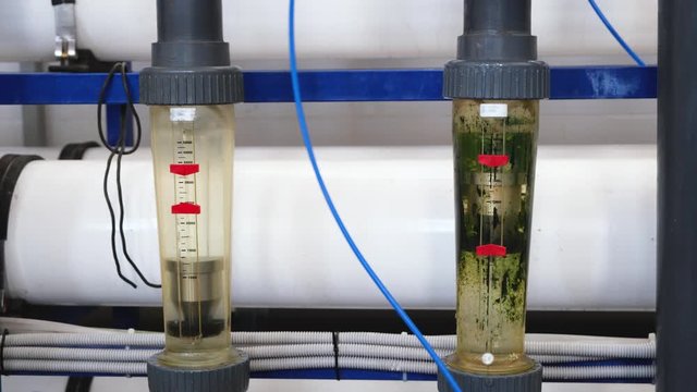 two rotameters, metering volumetric flow rate of water in tube, part of wastewater treatment facilities, filtration or purification of dirt water