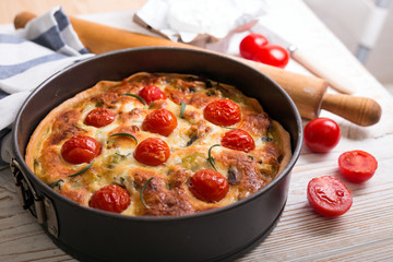 pie with  cheese brie and cherry tomatoes