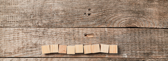 Wooden cubes mockup for creative inscription design, place for text. Empty blocks in line on wood backdrop. Copy space