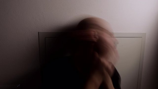 Time lapse of Segregated man going crazy. Segregation and isolation concept. Man in Quarantine. Depression concept. Caucasian depressed man